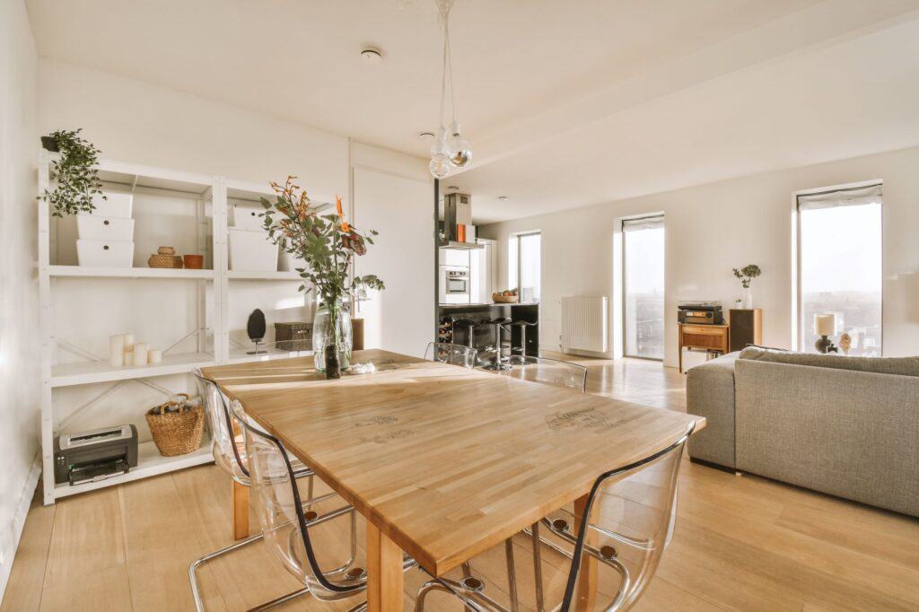 A dining room with a large table and bulky chairs