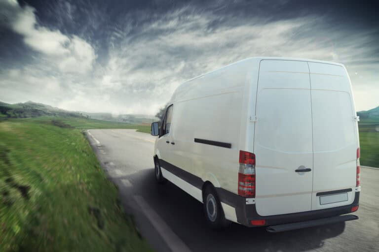 Man And Van on the road in a sunny day