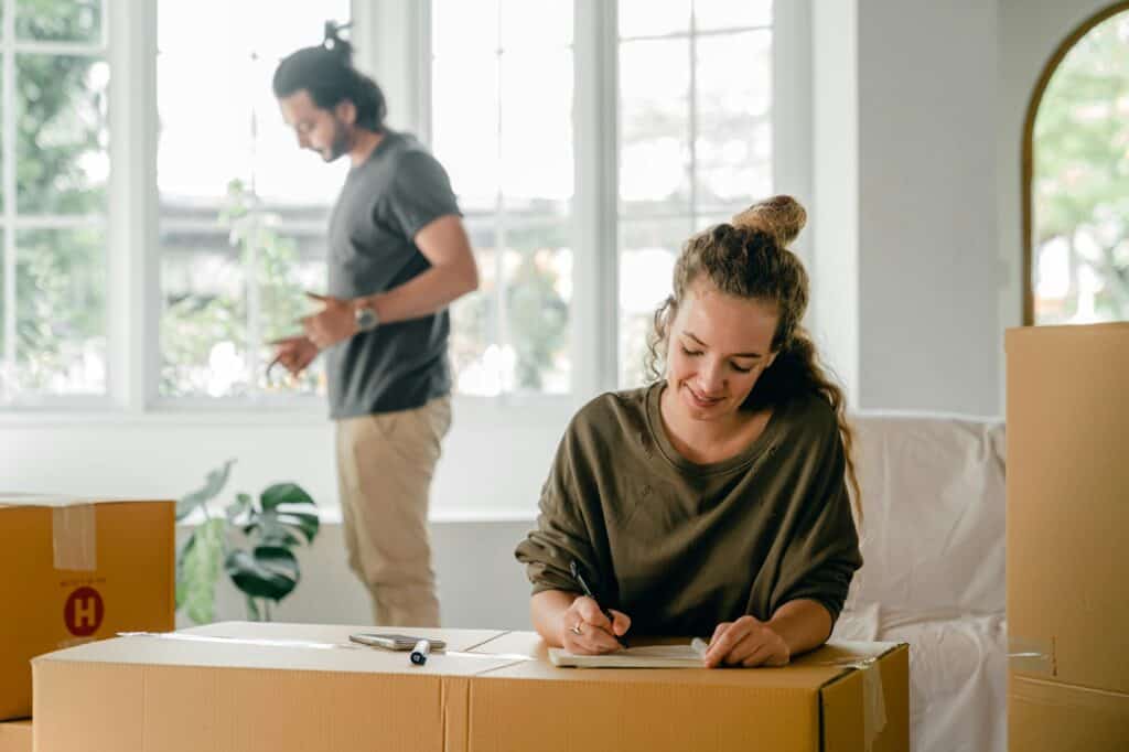 A couple is preparing for the moving day in the concept of moving to Islington.