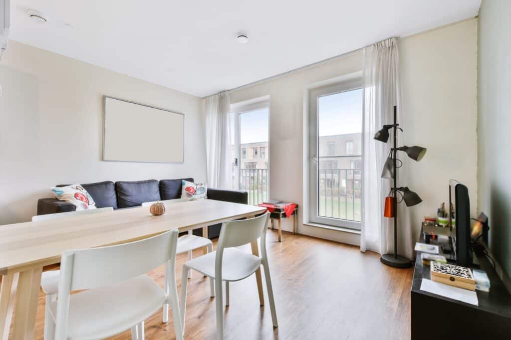 Living and dining areas with furniture in a studio flat in the concept of 'How to Pack Household Items Safely for a Move to Islington'.