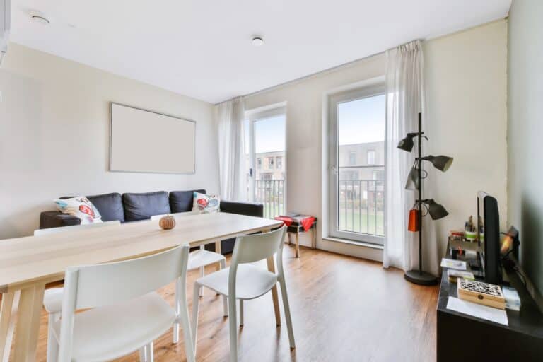 Living and dining areas with furniture in a studio flat in the concept of 'How to Pack Household Items Safely for a Move to Islington'.